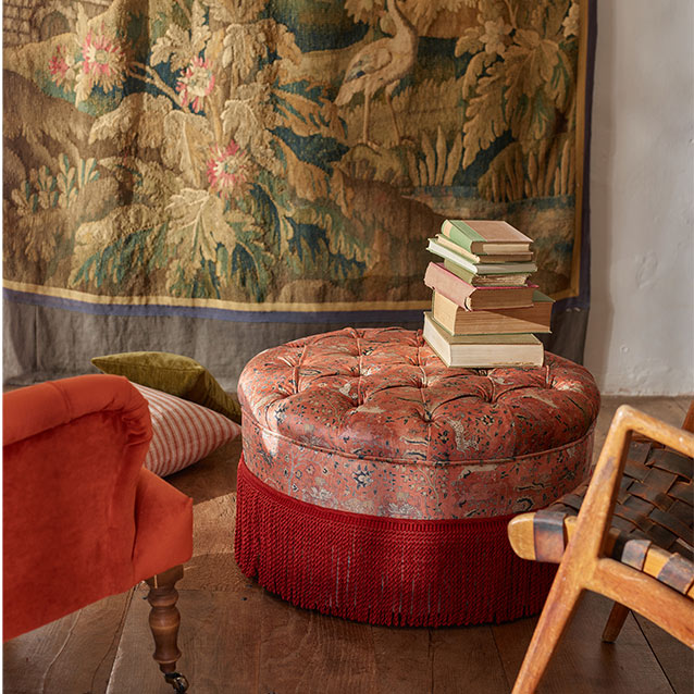 Burford Buttoned Footstool in V&A Threads of India Opulent Velvets Lahore Dynasty Flame with fringe in Sophie Bullion Fringe Currant